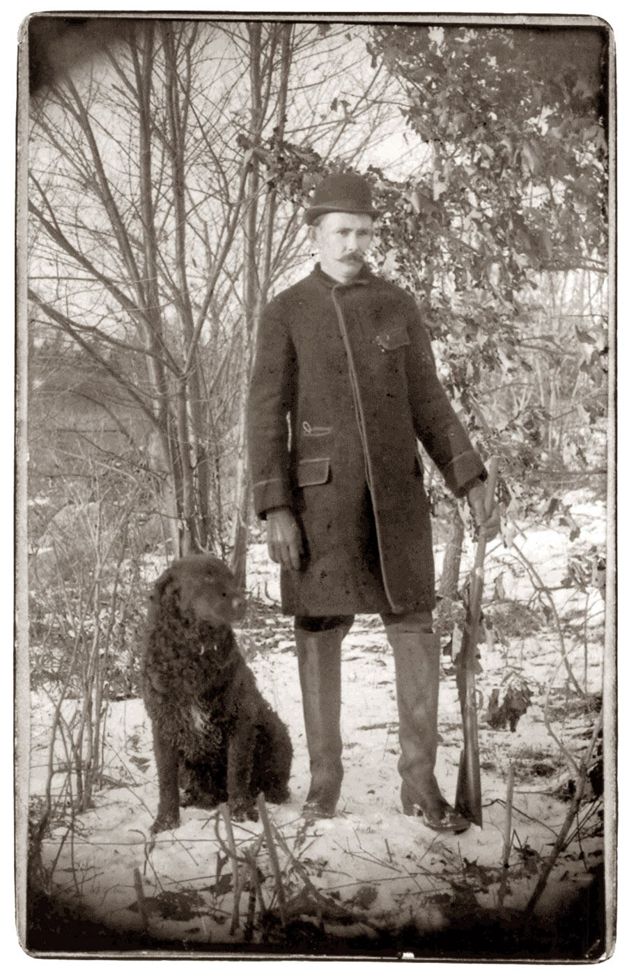 Royal Ernest Bibbins of Bridgeport, Connecticut, ready to hunt with heavy clothing, derby, boots, dog and rifle circa 1890. I never realized my grandfather was a hunter, but here he is all set to go. - Robert Edward McKenna