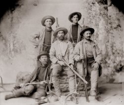 An old family photo taken in the late 1800s in Boulder, Colorado. Unfortunately no one has been able to identify anyone in this posed shot, although the man in the middle has the strongest family resemblance. View full size.