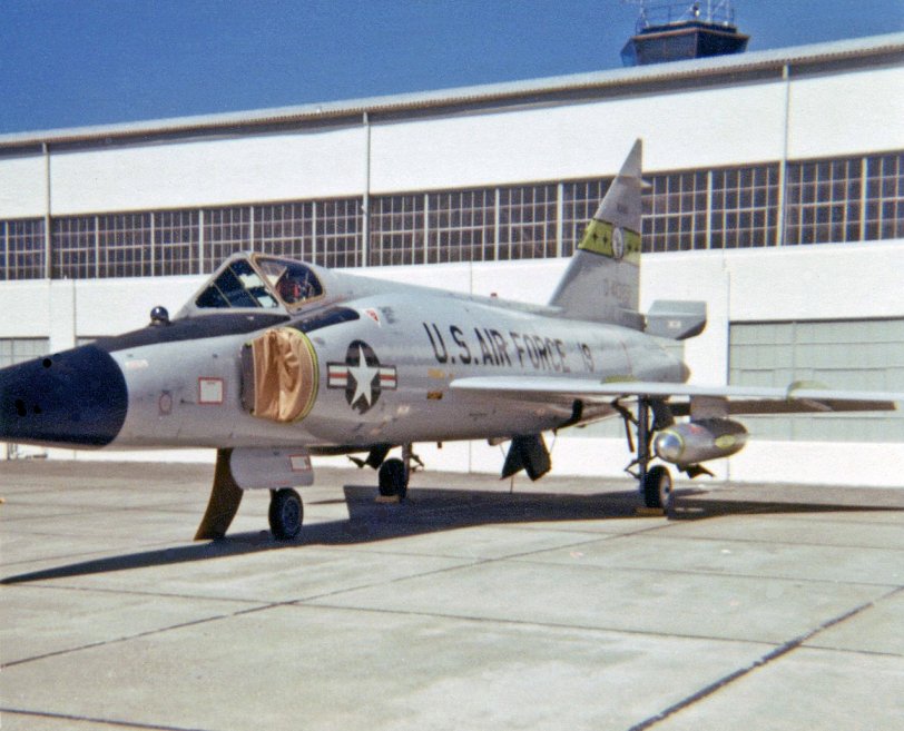 This is Hamilton AFB in Marin County, California in 1970 and the airplane is a visiting Convair F-102 "Delta Dagger" interceptor belonging to the Idaho Air National Guard.  Note the air intakes have been papered-over to keep hot dog wrappers, pop cans and various other airshow debris from damaging the engine when the pilot cranks up to fly home. It's too bad my mother didn't have a better camera.  Almost every photo she took with her Instamatic 110 was off-center to the right! View full size.
