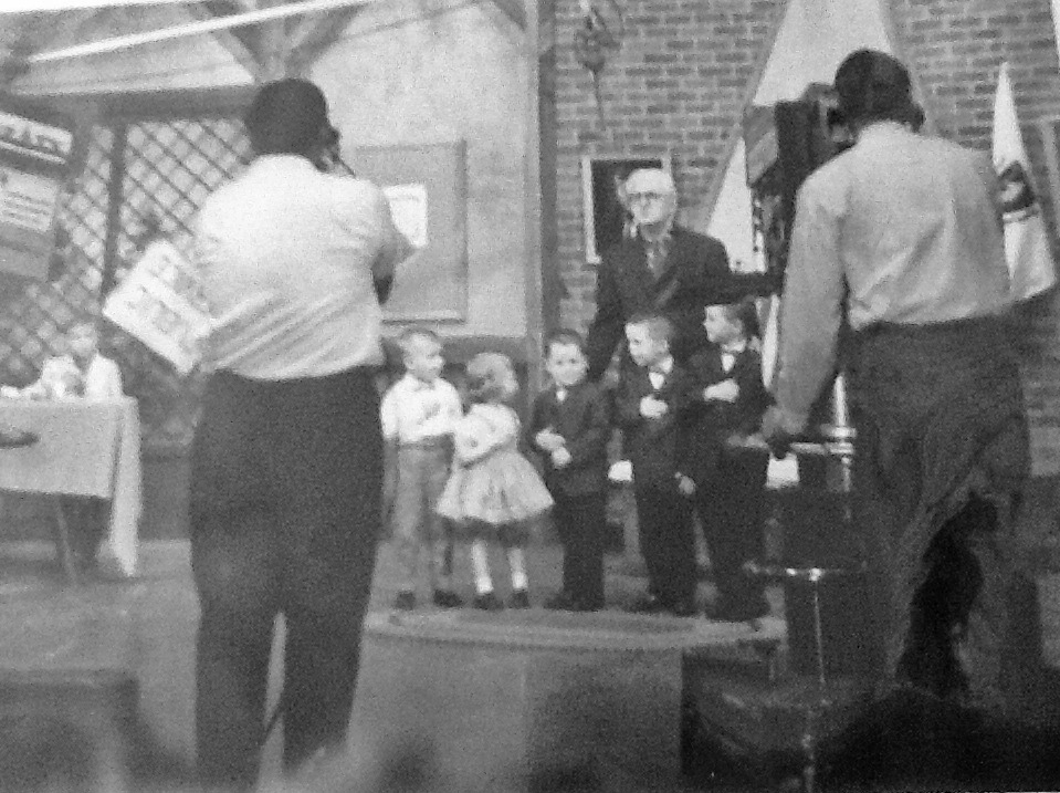 Big Brother Bob Emery and the small fry clan. Taken at WBZ television studios in Boston in 1963. My uncle was one of the cameramen. I am the little girl turning around.