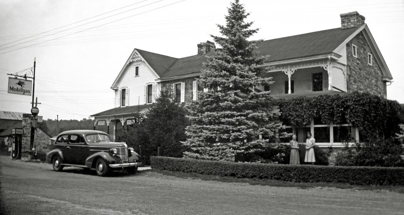 This is the old family home in Honey Grove, Pennsylvania, seen here when it was J.M. Long's Store and Post Office (on the left side) and the home of Harvey and Grace Henry (on the right side). This later became my grandfather's store and funeral home. The building still stands, looking much worse, and is no longer in my family. The figures standing in front of the building are my great-great-grandmother and great-grandmother. View full size.
