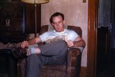 My dad around 1948, Valparaiso, Indiana. View full size.
Honoring slide-takersI've been trying to think up some suitable honor to bestow upon everybody who took color slides before 1950. And maybe one only slightly less exalted for before 1960. And another for all the people responsible for their survival to the present day. Sainthood maybe?
Welcome 1950Judging by that ad in the magazine, it's around Christmas 1949.
Thank DadYou have this man here to thank.  He and his brother, who took this shot.  Dad always liked taking slides over prints because of the quality and now we reap the benefits.  I have dozens and dozens more Shorpy-worthy slides to scan!
RadioThat radio looks like it was getting to be quite an antique by the late '40's.  Can any radio buffs i.d. it?  It looks 1920's vintage to me.
Dad&#039;s radioThe radio was made by the Grigsby-Grunow Company marketed under the Majestic name. In 1928, the Model 72 sold for $167 which is roughly equivalent to a $2000 purchase today...a sizable investment.
(ShorpyBlog, Member Gallery)