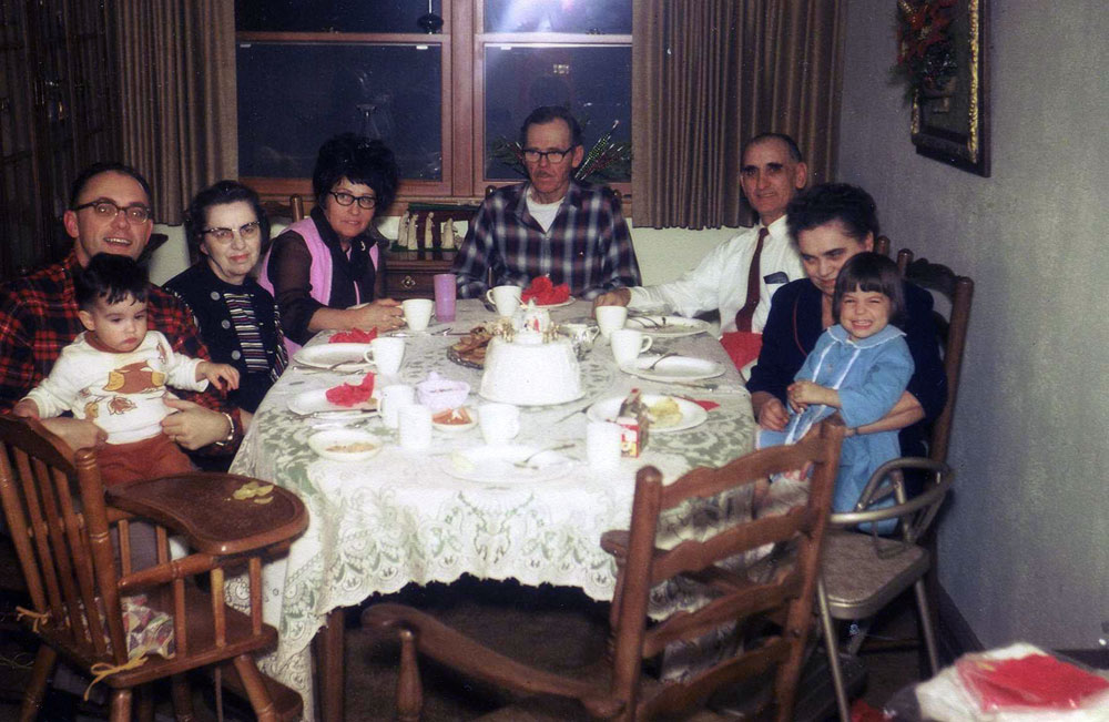 Christmas Eve, 1970, Bismarck, ND. L-R: Yours truly, age 1, sitting on my dad's lap, with my great-aunt Esther (yes, just like in Sanford and Son), my grandma Connie, my grandpa Terrance, my grandpa Aaron, my grandma Katie and my sister. With the exception of my sister, my dad and me, everyone in this photo has "gone west." I miss them all. View full size. 