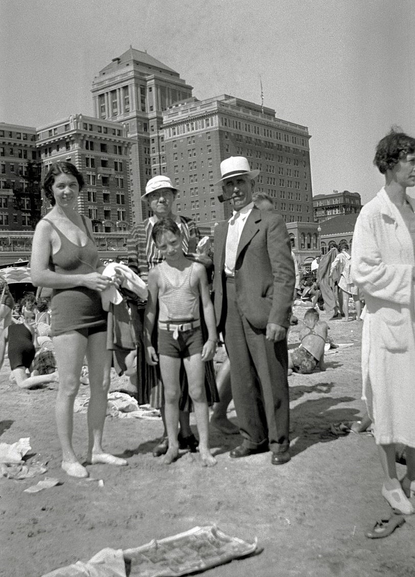 My grandfather (the kid), great-grandmother, and unidentified characters on the beach at Atlantic City, with the Chalfonte-Haddon Hall (now Resorts) rising in the background. Circa 1935. View full size.
