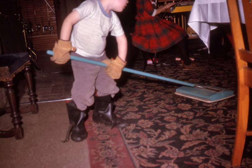 From a Kodachrome slide. Okay, so it's a not a gun. But he could be one of them dust bunny rustlers. View full size.
