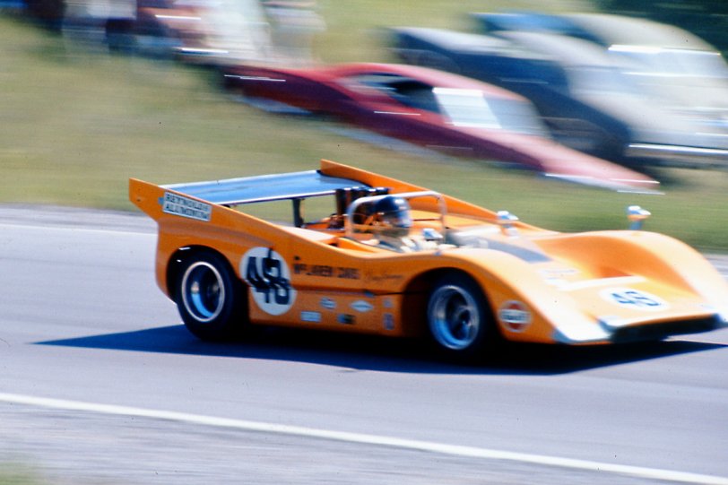 The passing this past week of American racing legend Dan Gurney got me searching back to 35 mm slides I took at the 1970 Mosport, Ontario CanAm race. The race was held just weeks following the tragic death of Bruce McLaren, test driving one of his cars, and Dan stepped up to replace him driving one of the dominant Team McLaren "Orange Elephants", M8Ds with big-block Chevrolet engines. Dan drove to a victory in car 48, supported by teammate and fellow McLaren Kiwi, Denny Hulme. As McLaren was a dominant force, both as driver and constructor, so was Gurney. View full size.
