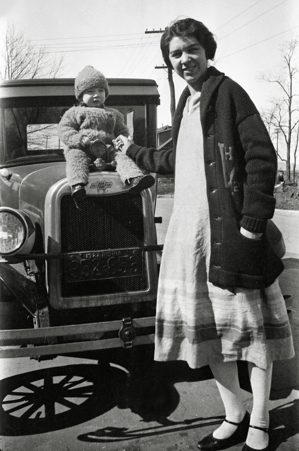 My grandfather and great-grandmother in 1927, as little Jack sits on the hood of a Chevrolet in Pennsylvania. View full size.