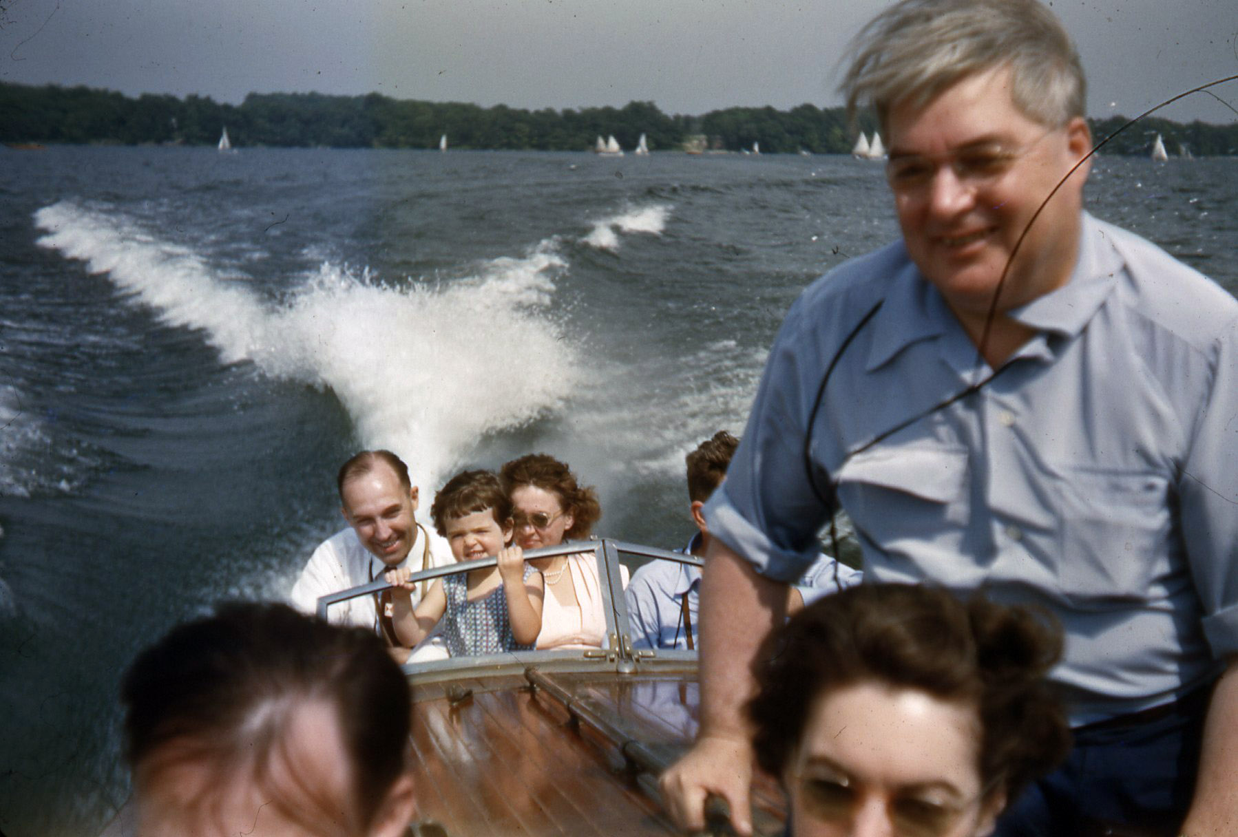 Unknown subjects, apparently shot by my dad's brother on his boat, perhaps on Bass Lake, Indiana. Kodachrome slide. The hair in the upper right was not on the slide.  