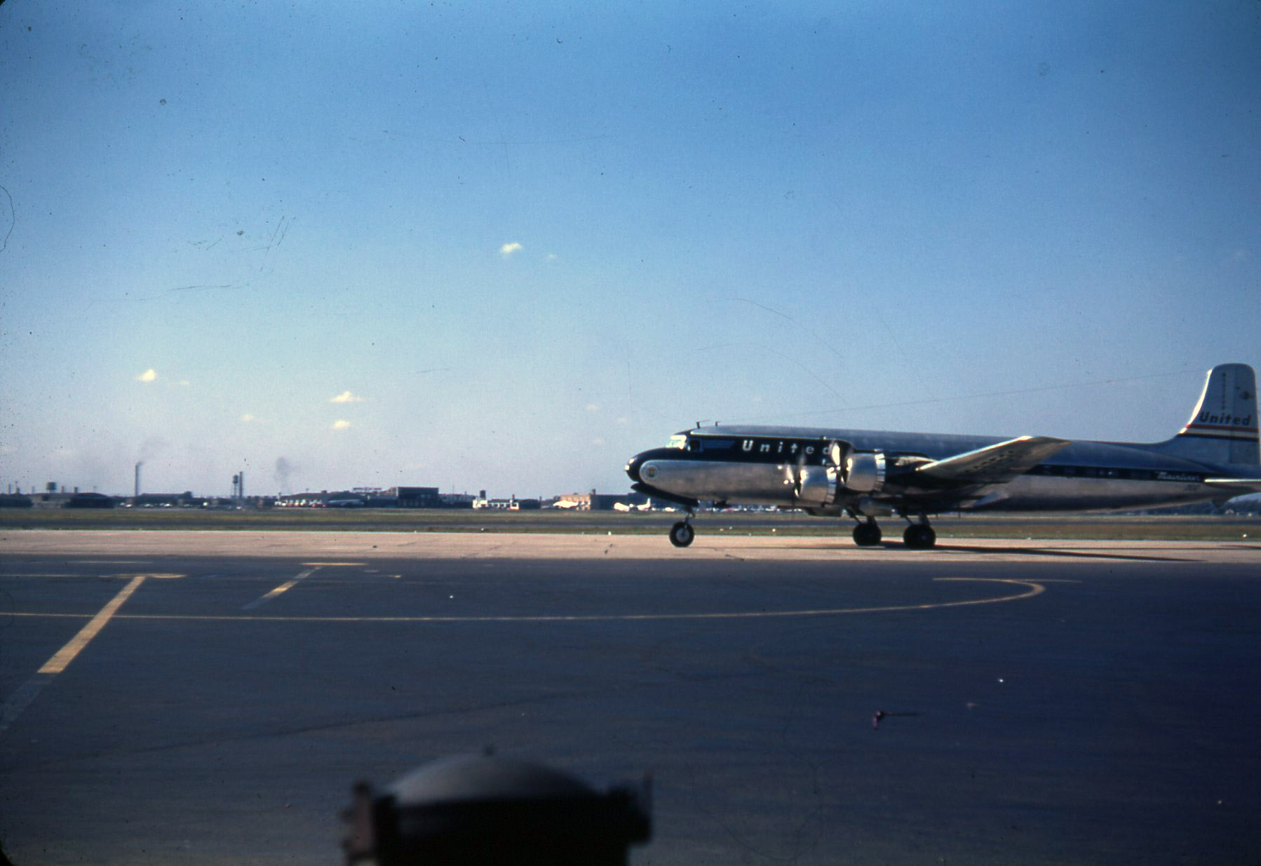 My Grandma and Grandpa arriving in Chicago, maybe?  Late 40's Kodachrome. View full size.