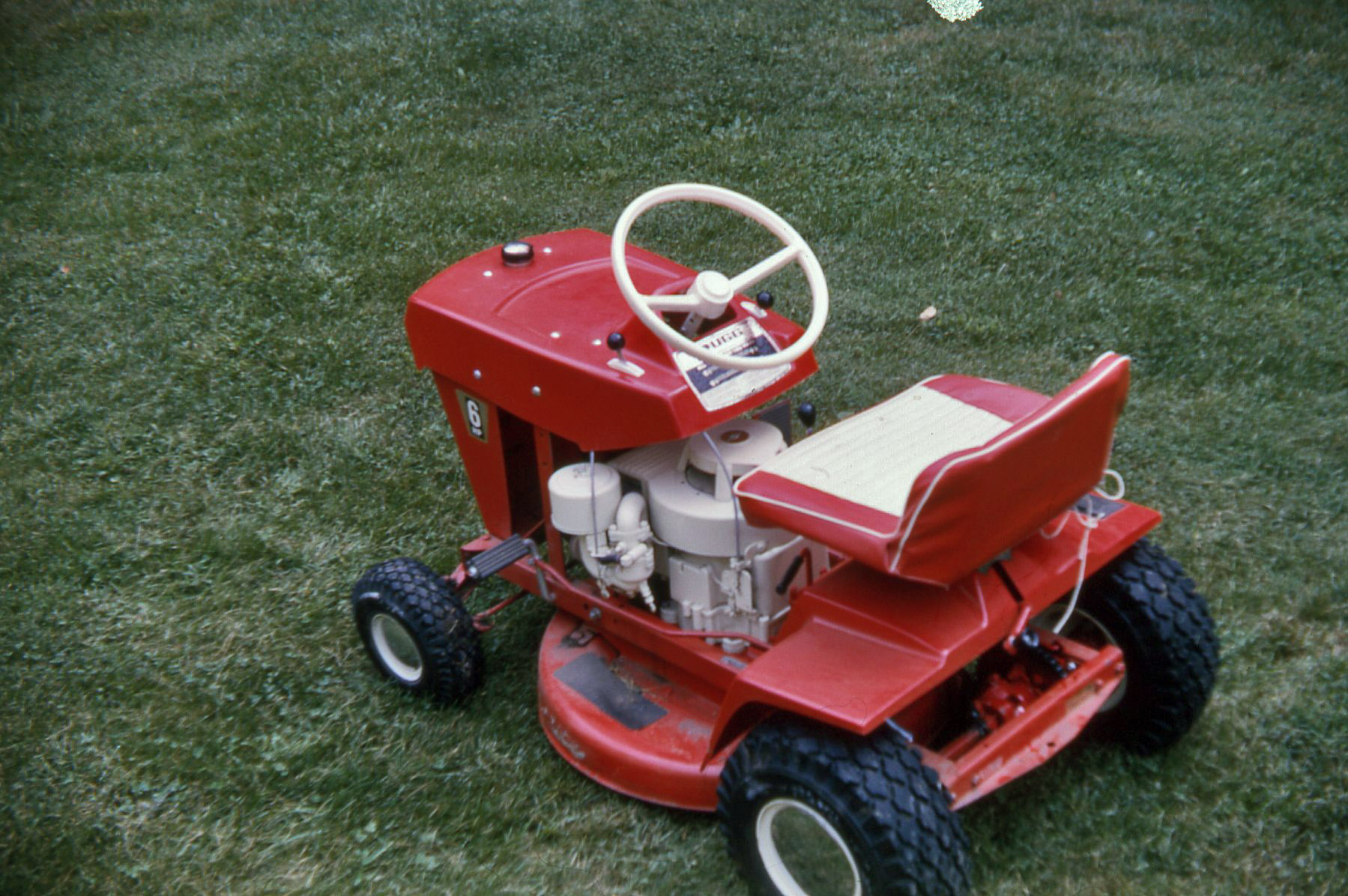 My uncle's new lawn tractor.  1965 Kodachrome.