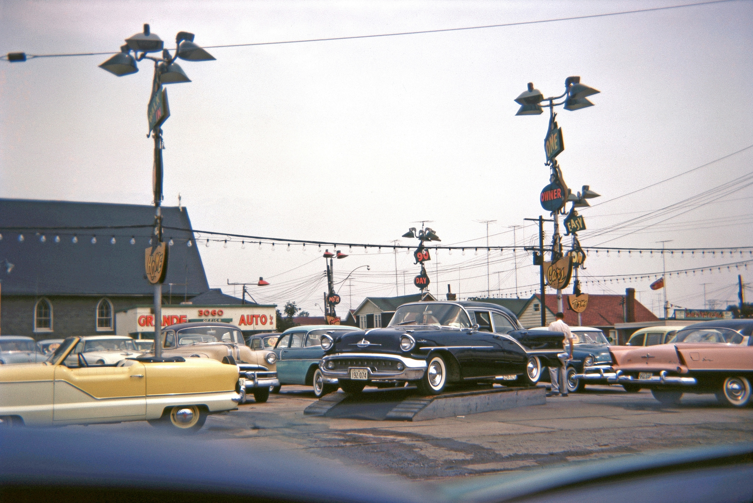 A Kodachrome slide I acquired, showing a car dealer somewhere in Ontario, Canada, circa 1958. I've tried to find the exact location. Another picture shows the crossing with Eastville Avenue. View full size.