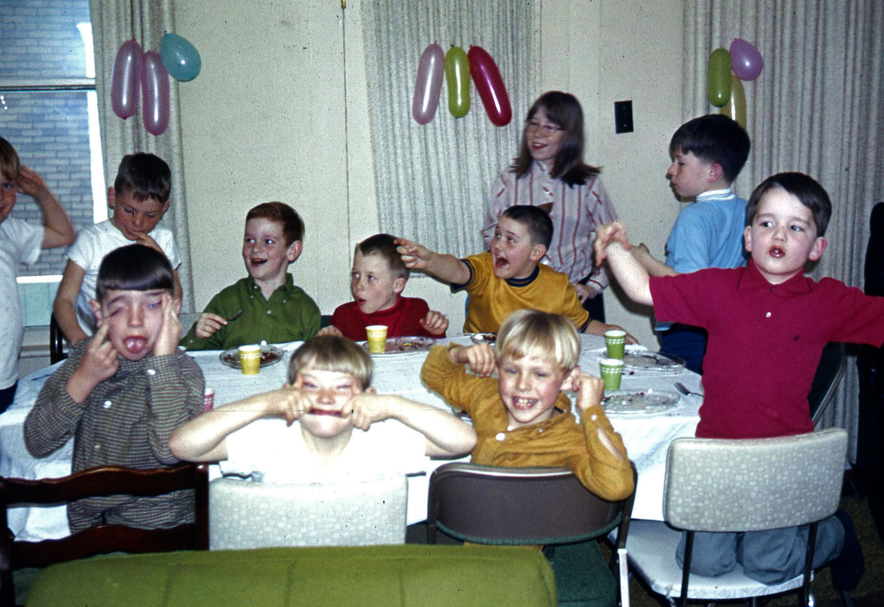 I see 1 Moe, 1 Curly, and 4 or 5 Larrys. 1969 birthday party in Rochester, Indiana. From a slide. Their faces really did stick like that if you think about it. We're looking at them now. View full size.