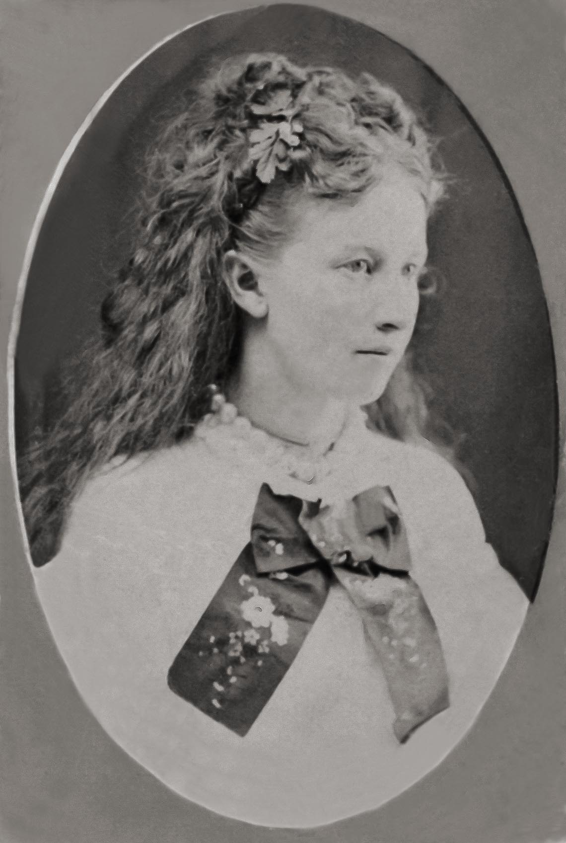 This is a portrait of my second great grandmother, circa 1868, when she was approximately 16 years old.  Likely taken in Owosso, Shiawassee county, Michigan