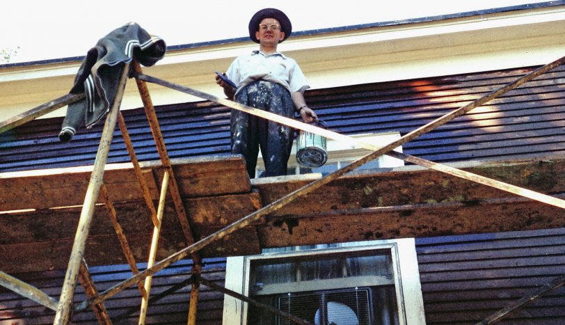 Here's Dad, circa 1960, painting Grandpa Peter's store on King Street in Niagara-on-the-Lake, Ontario. Shortly after, I remember helping Dad lay new tar paper and asphalt on the roof. View full size.
