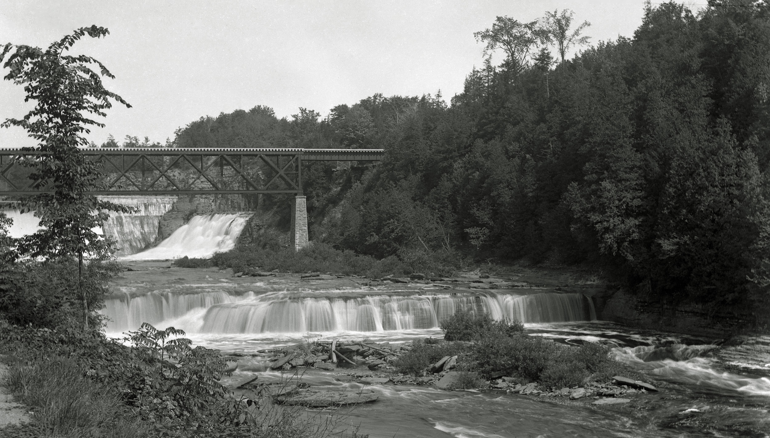 From the collection of film and 4x5 glass negatives I recently purchased. In this photo, the dam, built circa 1906, can be seen.  There is a lot more water in the gorge in this photo than one sees today.  For the past 10 years or so, the power company had opened the falls on two weekends every year, but all that did was let us see what was lost to the need to generate power.  That practice ended a couple of years ago, in any event. View full size.





