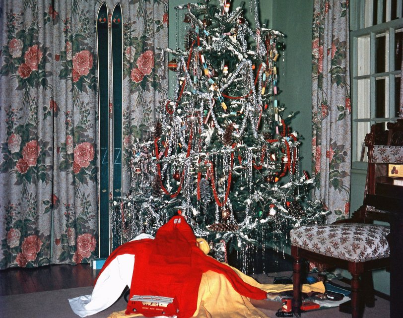 A shot Dad took on December 25, 1960, Bedford Quebec, of Santa's "bounty". He was into whipped Ivory Snow and lots of tinsel for the tree, with never too many decorations. Skis and outfit for my older brother but for a ten-year-old me, a Dinky Toys car carrier complete with Jag and house trailer was perfect. Who thought those pieces would be worth a fortune today? View full size.
