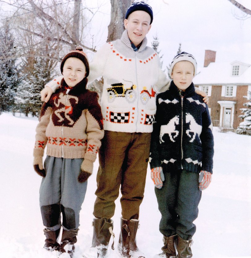 Here're my brothers and me, late 1950s Bedford Quebec, wearing sweaters that my aunt knitted for us. They were amazingly warm (were they wool?) and she put a lot of work into them. I'm on the left, in the now-cringe worthy "Indian on the warpath"-themed motif. View full size.

