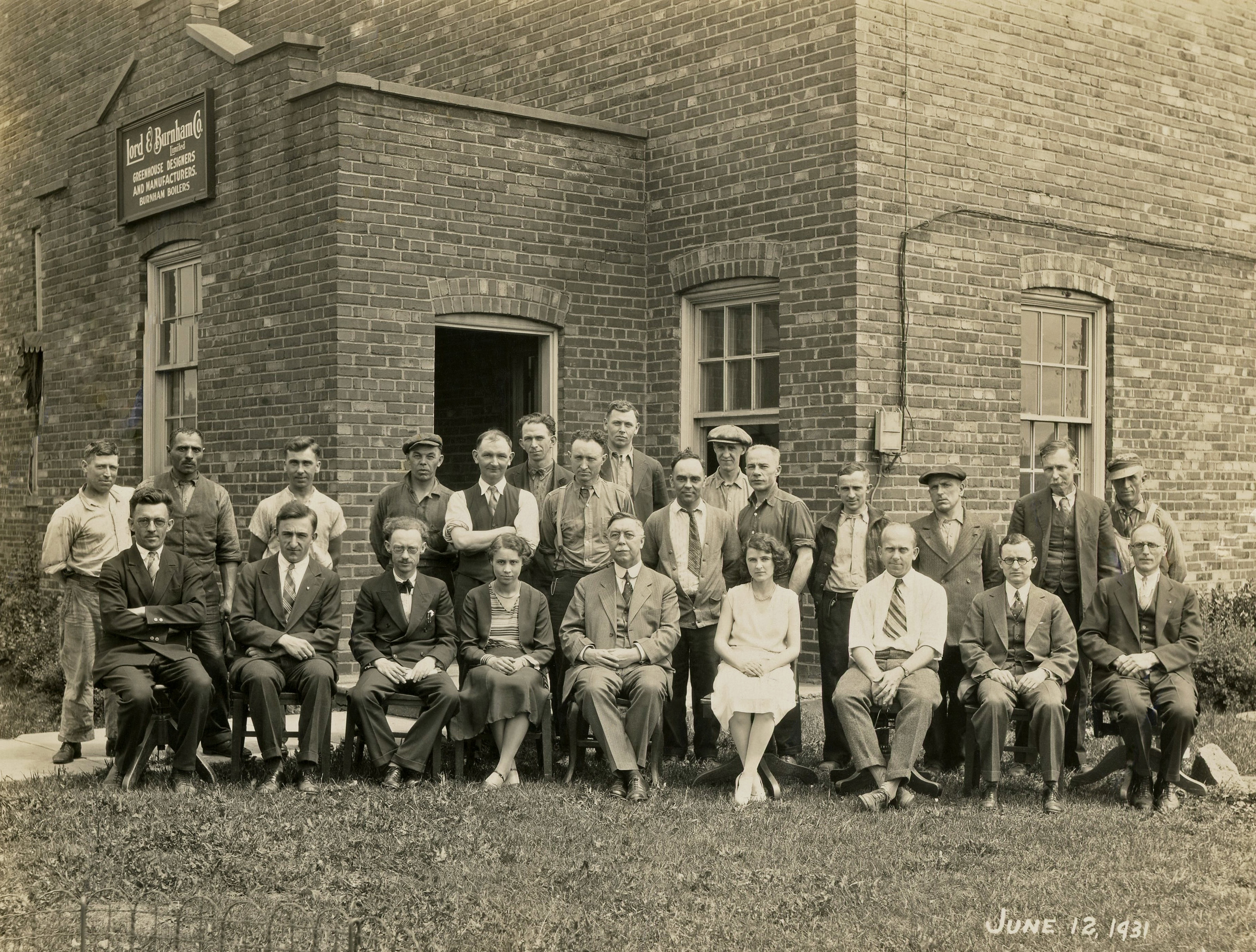 Employees of Lord & Burnham Company, greenhouse designers and manufacturers, St. Catharines, Ontario, Canada. This photo was taken outside the factory on Welland Avenue on June 12, 1931. The distinguished gentleman ensconced between the two ladies is my great-grandfather, Edmund I. Lorenzen. View full size.