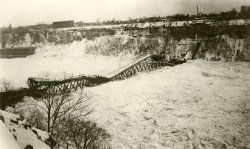 The Fallsview Bridge spanned the Niagara River below the falls between Niagara Falls, Ontario and Niagara Falls, New York (seen here). During the especially harsh winter of 1938, large quantities of Lake Erie ice were swept down the river, building up in the gorge below the falls, On January 27, the pressure of the ice on the bridge abutments caused a catastrophic failure of the structure. View full size.
(ShorpyBlog, Member Gallery)