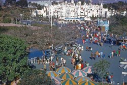 Disneyland, 1969. Kodachrome slide by my dad. View full size.
It was a Small World in 1969It's A Small World was one of my favorite Disneyland rides. If it was hot outside it was cool inside. When I graduated from high school in Long Beach in 1966 Disneyland was a great and relatively inexpensive date night back then. Grad Night was filled with high school graduates and dates for a few dollars and my date Jill and I were there. By 1969 I was in the Air Force flying over Laos and the Ho Chi Minh Trail. I see two Marines walking through the scene and wonder if they are from Camp Pendleton on liberty with Vietnam in their futures. My 6th grade teacher, Mr Kim (a WW2 Marine), was one of the engineers on the Disney train and in 1995 I introduced him to my 5 year old daughter at the Small World train stop. He invited us into the cab of his diminutive locomotive and we rode around the park in style. I've been watching the Ken Burns documentary on Vietnam and Disneyland in 1969 was obviously in a different world.  
(ShorpyBlog, Member Gallery)