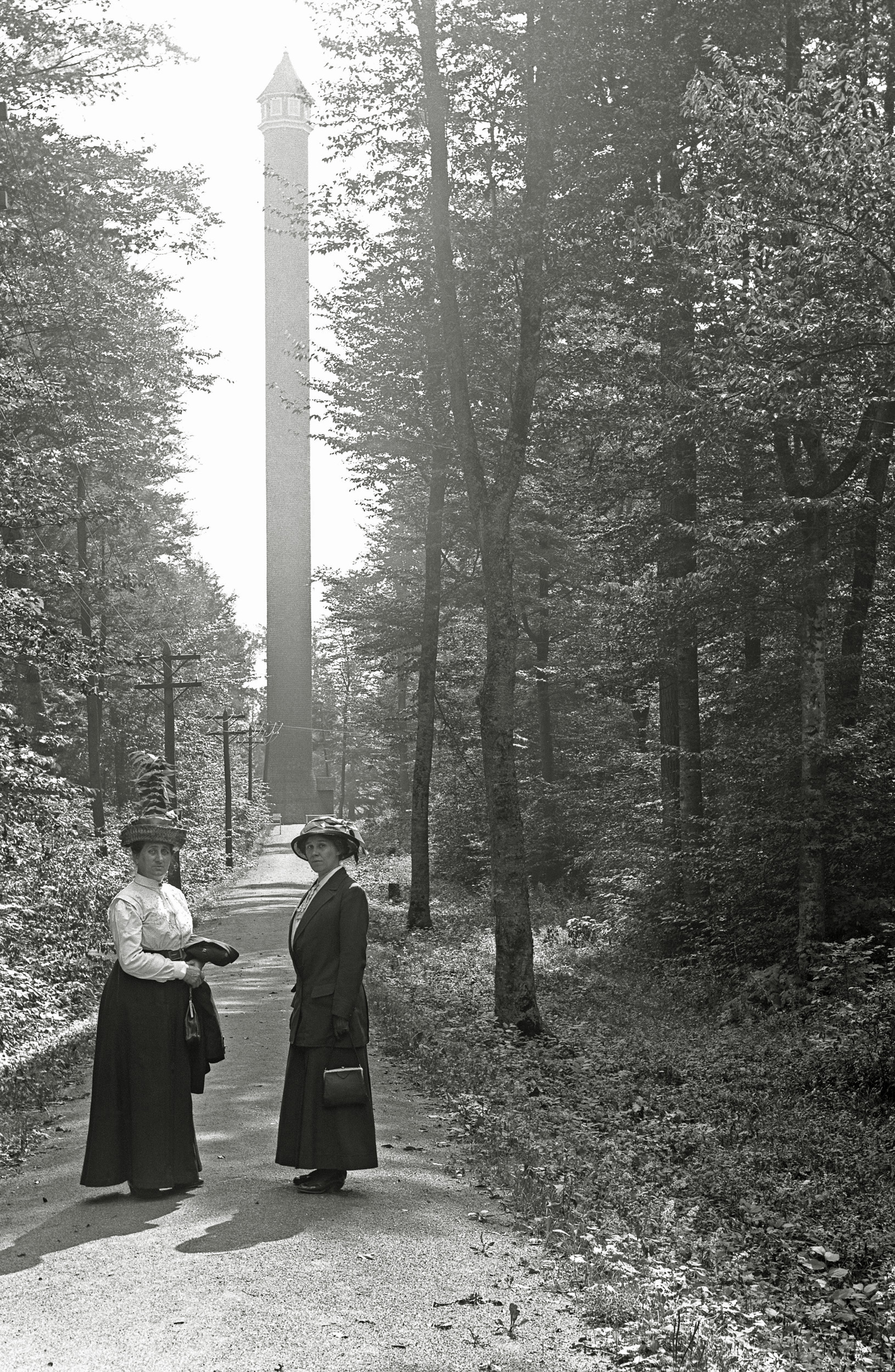 From the collection of negatives I recently purchased, the upstate New York woman again, this time with a companion and a tower; I hope some Shorpyite can identify it. It's brick, and obviously made as an observation tower, but where?  As far as we know nothing like this existed at Trenton Falls, but we know she'd visited Niagara Falls and cruised the Hudson River on the 400 ft. Hendryck Hudson, but we haven't found this curious tower anywhere. View full size.