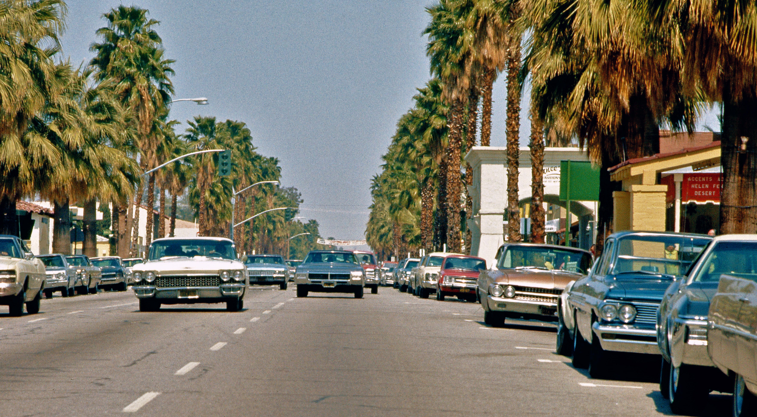 Los Angeles Palm Springs from my first trip to Southern California in March 1969 as a teenager. I took this squatting in the street for visual effect with a Pentax 35mm SLR. Lots of 1960s (and classic 1950s) iron to enjoy, but darned if I remember what street this is! View full size.