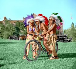 A photo found here on this site and colorized.
I "think" the original photographer was trying to make a statement about the young American Indians of their day, looking to the future and using a modern machine to do it.
The only problem is, that only one looks like he might be a native American Indian.  There are three of them and only one bike so I don't think they are not going to get very far.  And there were cars during the time of photography, but the white man is not parting with something like that.
At least that is what I took away from the photo.
Other than that, it is a very nice photo.
I use bright warm colors almost always, so you know the photo has been colorized.  Colorization gives a surreal quality to the work.  I rarely try and make the colorization process look natural. Sometimes the photo calls for nothing natural to be done at all.
I am always looking for interesting photos to colorize.  They usually have to be of very strange events, things we have never seen before. We see photographs all day long, so the only photos that catch my attention are of things we "don't" see everyday.
I do a lot of "vintage" nudes and erotica.  It is interesting to see and we sometimes forget that even if it was 100 years ago, we are all basically the same animals then and now.
We repeat ourselves, but we forget we have done so.  We are no different today, or 100,000 years ago.  Same base desires.  Same wishes.  Same hopes.  Same murderous impulses.  Same lustful wishes.
But for all of what we think of as being the "bad" parts of ourselves, all of these things have made us the most successful species "EVER" on this planet and as far as we know, in the universe.  How can that be bad? View full size.
(Colorized Photos)