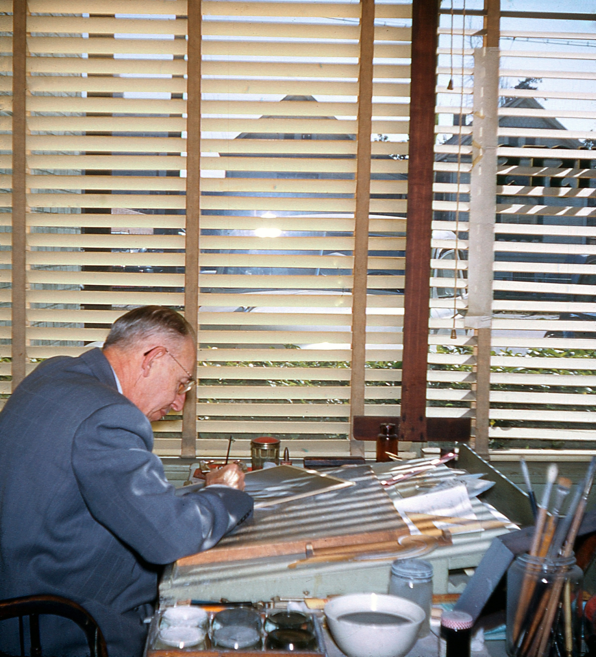 An inside view of the Meriman Photo Art Studio at 1411 Maple Ave., Los Angeles. This is one side of a stereoscopic pair; the mount was labeled "Mueller," presumably this gentleman. View full size.