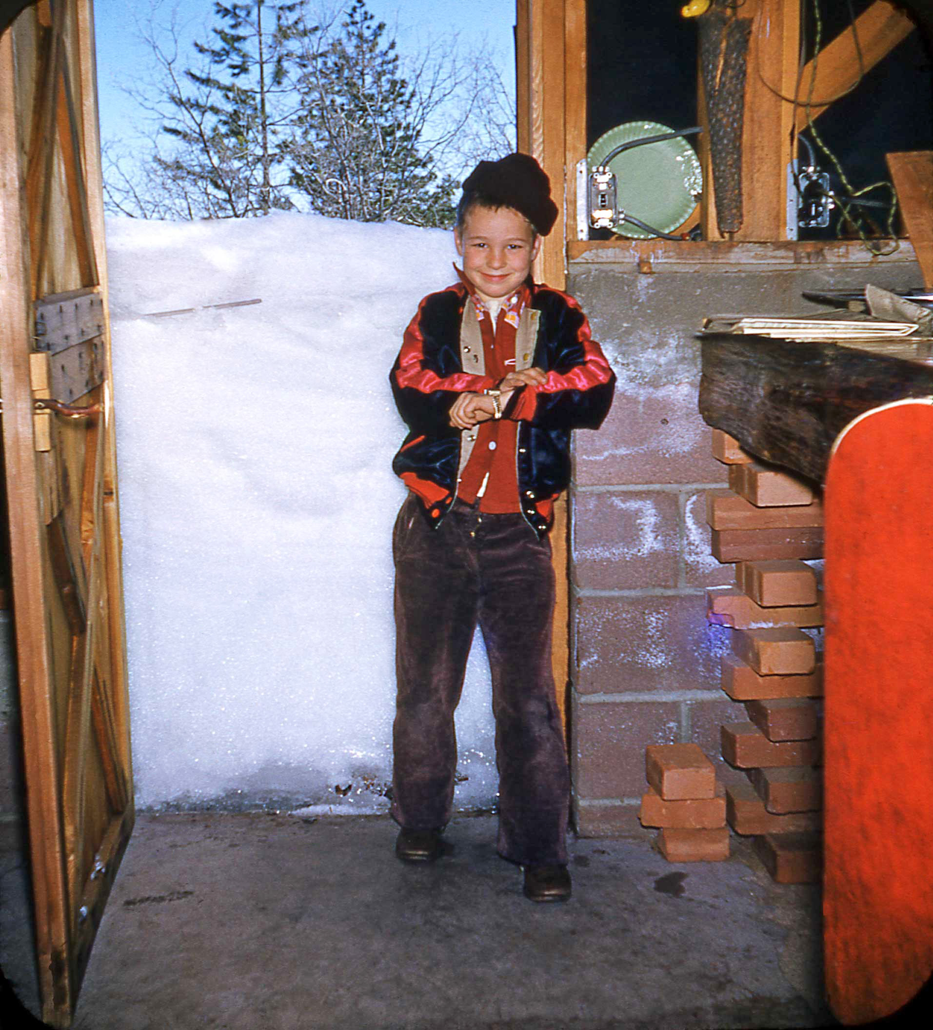 This is Rauleigh, previously seen in the colorful kitchen. He's almost 10 (Edit: I made a mistake, he is about 8 in these 1951 photos) in this Kodachrome taken at the "south porch" door of a cabin in Running Springs, California in 1951. From a set found in a thrift store. View full size.