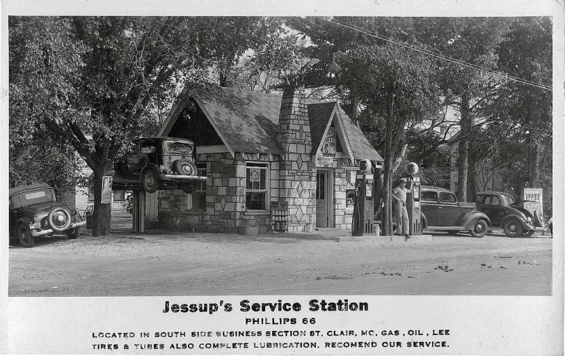 St. Clair, MO, late 1930s. This quaint little sandstone-covered gas station was enlarged in the late '40s, and later razed, replaced by a parking lot for the bank next door.
