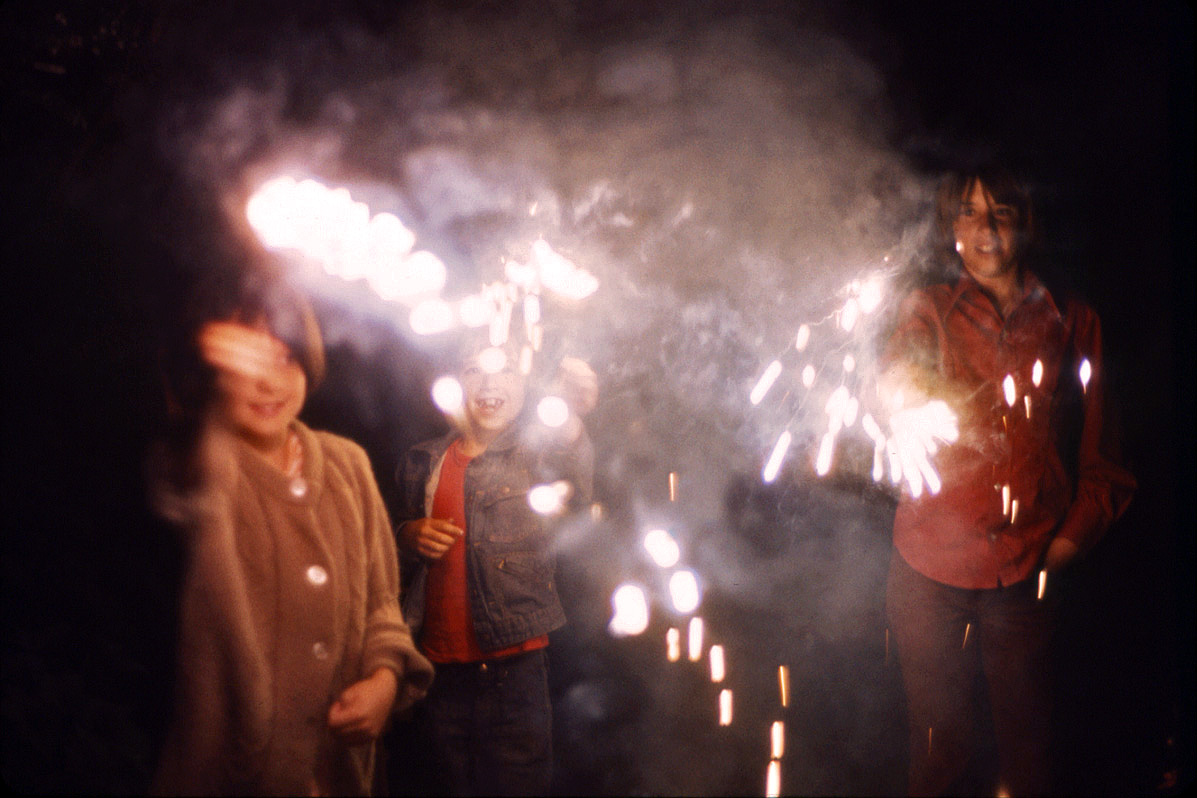 July 4, 1973. My niece and nephews with sparklers. View full size.
