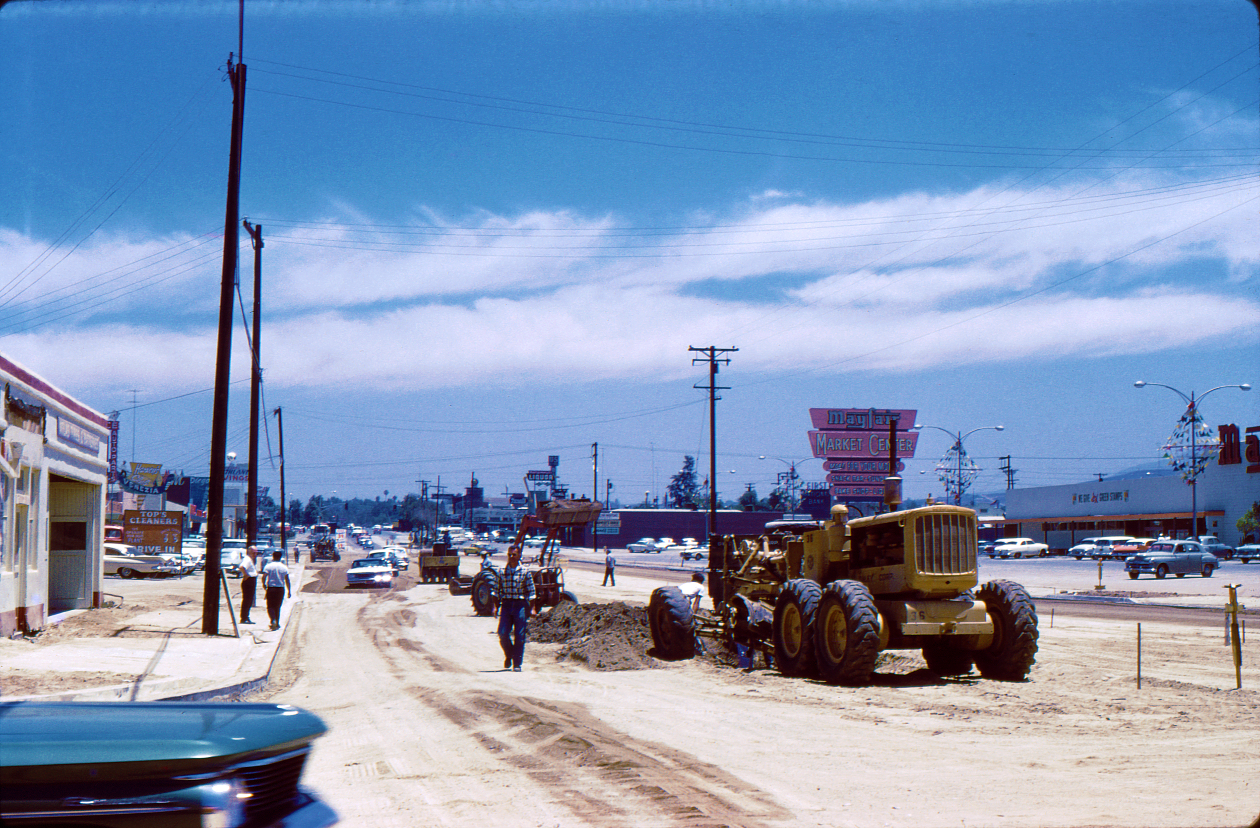 Here we have some road construction taking place in an unknown Southern California town. This photo was taken in June 1960. Scanned from the Kodachrome slide. View full size.