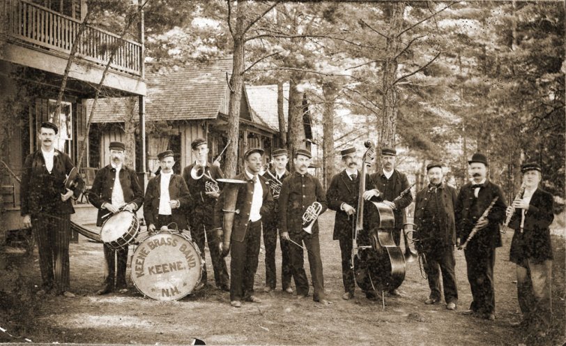 When my maternal grandfather, F. Harold Tyler, captioned this picture, there were a few unknowns.
Location: Forest Lake, New Hampshire. Cymbals - ?, Drums - Allie Tyler, Bass drum - John Barrus, Alto - (Harry Alexander scratched out), E-flat Bass - Cooper (ran a restaurant where Beedle Music Co. was on West Street), Alto - Harry Alexander, Cornet (leader - ?), Bass Viol ___ Hill, Clarinet - Fred Farr and Summer White, E-flat Clarinet - Geo. Bowker, Trombone (between Farr &amp; White) - Norm Davis. Music runs in the family. "Allie" Tyler would likely have been my great-grandfather. This is the only time I've seen that nickname, he was Albert. Harold was best known in later life as a flute and piccolo player, though he played in a drum corps as a young man. The photo was likely taken prior to 1900.
