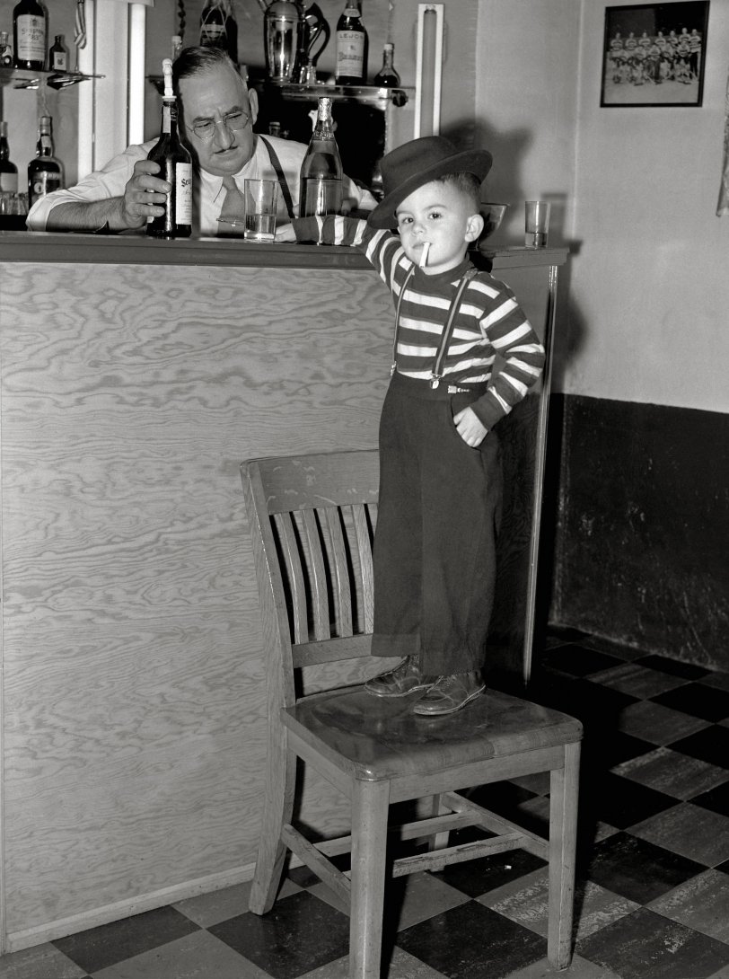 1940s photo taken by my grandfather, Detroit News photographer Howard McGraw of a young man who's really just too cool for words.  Don't worry, the cigarette is not lit!  Scanned from a 4x5 negative. View full size.