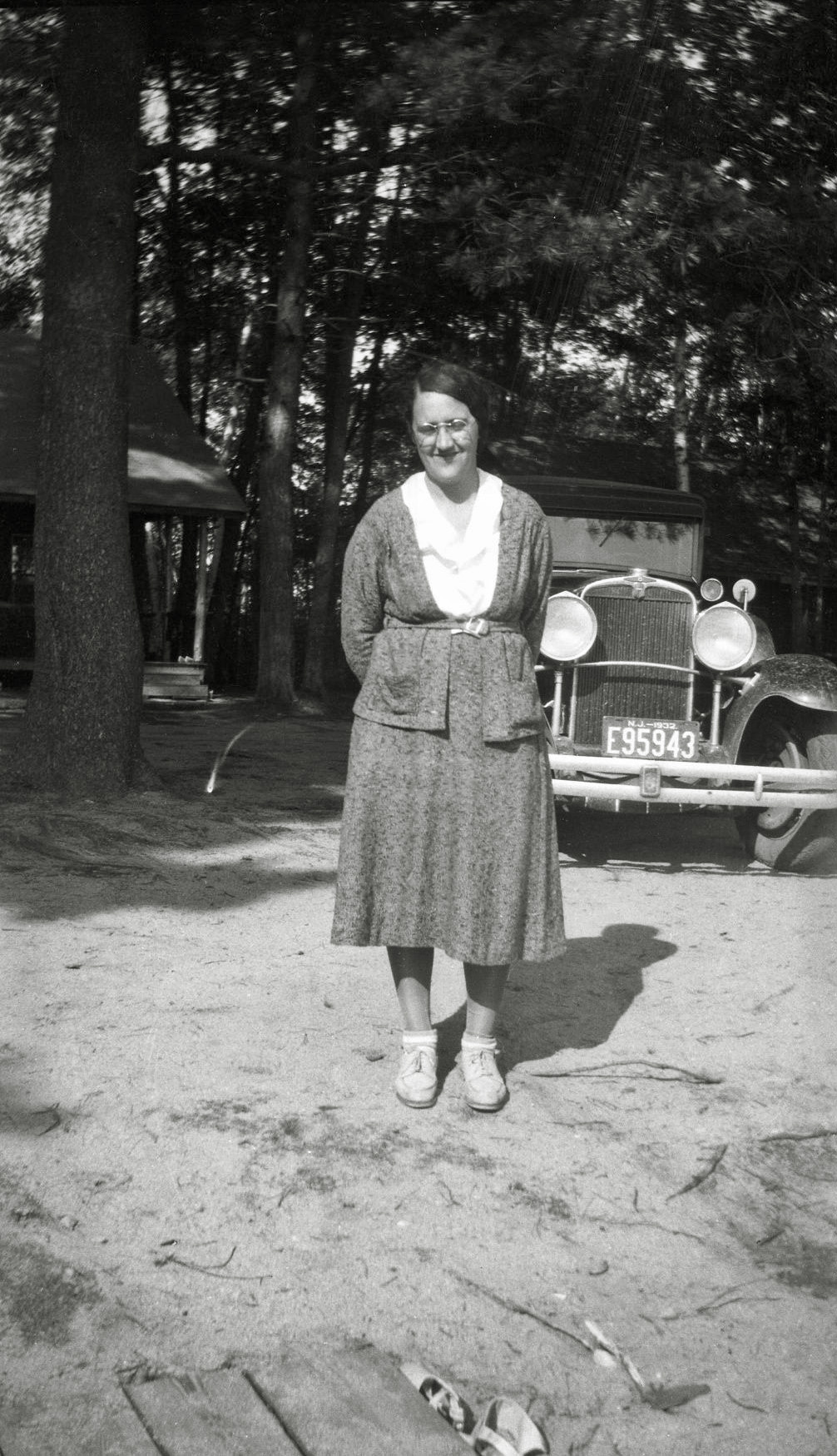 Going by the date on the car license plate this was taken in 1932. Sadly I have no other information on who this is or where taken. Can anyone ID the car? I'm stumped. From my negatives collection. View full size.

[The car is a Nash, about 1931. -tterrace]