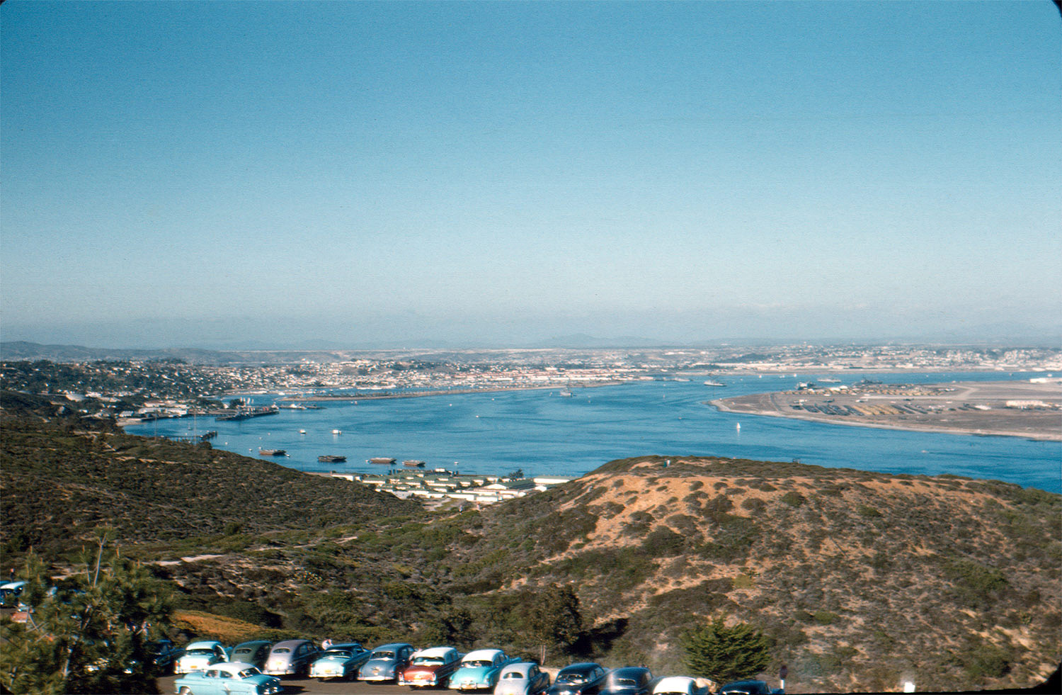 A lake and old cars, somewhere in California? Another thrift store slide. View full size.