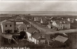 This is the town of Fields Landing on north side of Humboldt Bay in Calif. The main road that goes to the foot of the bay leads to a whaling station. The large building to the front is known as the whalers inn. Postmark on this post card is dated 1912.
Fields LandingGreat to see this picture.  I grew up there. I can see the house where I grew up in this 1912 pic. I remember the whaling station!  Talk about smell!  When a whaling boat was coming in with a catch, word would spread fast.  I would go with older siblings to watch them butcher the whales.  We'd put handkerchiefs sprinkled with perfume over our faces to diffuse the smell. That was in the 1940's, maybe early 50's.  When I was young the Whaler's Inn was just known as the Fields Landing Hotel. That road running in front of the inn is Highway 101. They put in the new freeway in 1960's.
(ShorpyBlog, Member Gallery)