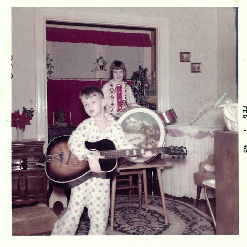 This is my older brother and sister, taken at home in Jersey City, NJ, in February 1965 before I was born. The Beatles had arrived in the US in 1964, and of course my siblings both wanted drums and a guitar for Christmas '64 to emulate their favorite group. View full size.
