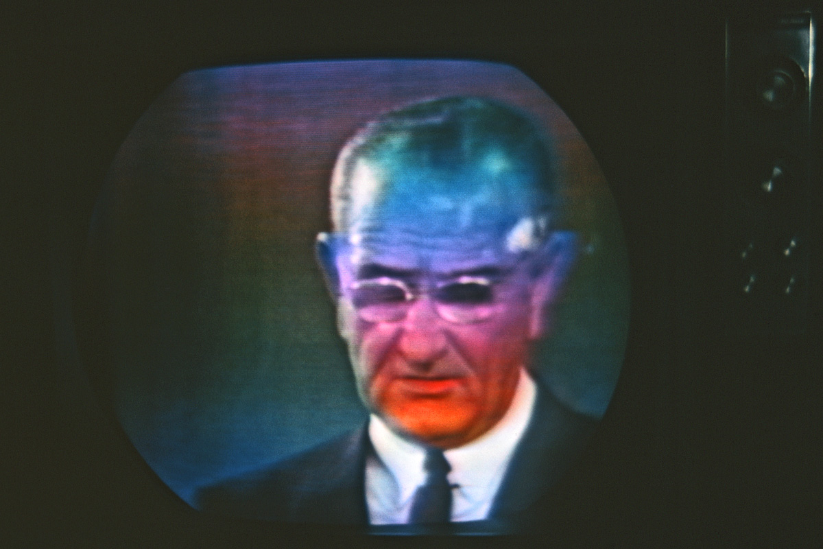 May 1967. I liked to see what weird effects I could get fooling around with the controls of our color TV. If you turned the horizontal hold just to the point where it was about to lose it, you'd get something like this. If the President of the United States happened to be on, that is.
