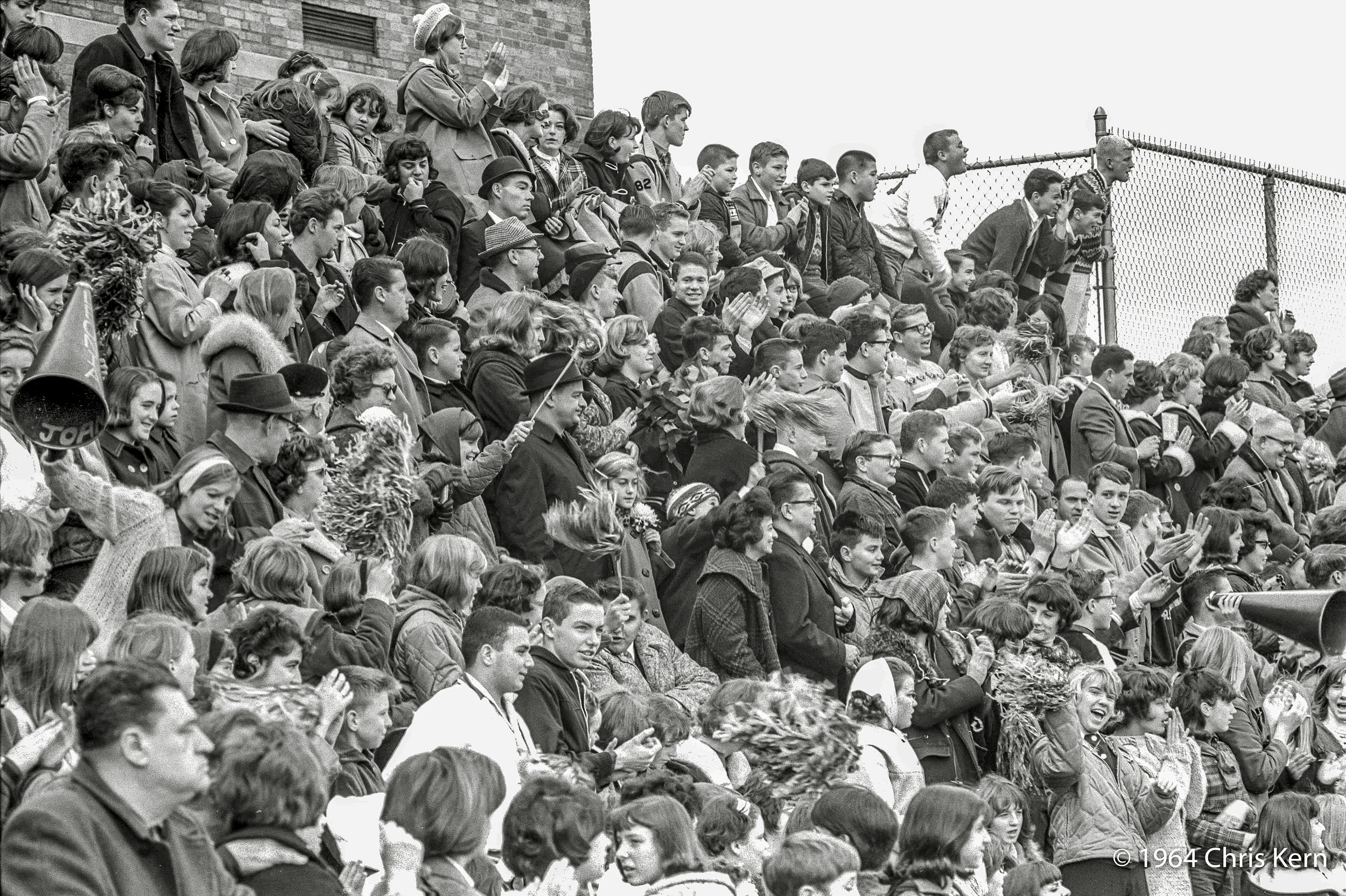 Autumn 1964. Football fans at Leonia High School in Leonia, New Jersey. 35mm negative taken by me. View full size.