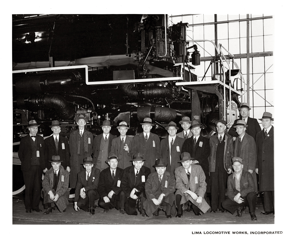 Lima, Ohio. December 1941. The brilliant C&O/Lima Locomotive design team poses for a photograph in front of their latest creation--a 2-6-6-6 Allegheny. Despite years of claims to the contrary, this first series of Alleghenies were indeed the heaviest steam locomotives ever built.  This photo was taken by the Lima company photographer mere days after the attack on Pearl Harbor, and for C&O the first ten Alleghenies came right in time for the surge of war traffic on America's railroads.  