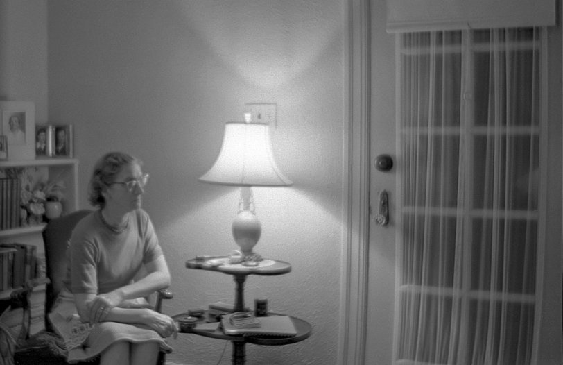 My mother, watching TV in our living room. Taken with a c.1935 Kodak Junior Six-16 we happened to have sitting around the house. At the time I was chafing at the restrictions of the simple cameras I'd been using, specifically the inability to do long exposures in low-light situations. In addition to the "T" time exposure setting, the Six-16, like many older cameras, also had a "B" (for "Bulb") setting for use with flash; the shutter would stay open for as long as you held the release button down. While it was down, you set off your flash bulb. View full size.
