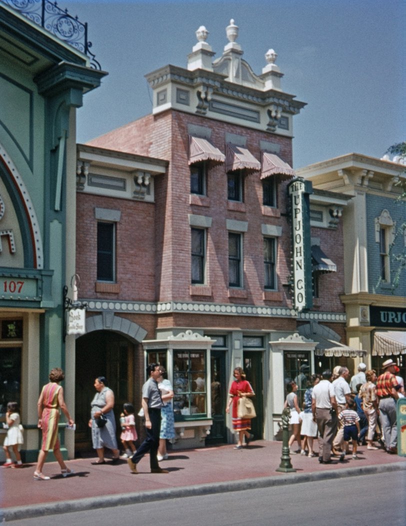 The other day, Shorpy posted this photo of Saratoga Springs, which Dave described as "looking more than a little like one of those idealized Disney 'Main Streets'." One perspicacious commenter pointed out that Disney's relationship to the historic period portrayed in his Main Street (approx. 50 years past), would be like ours to the 1950s and 60s. So here you have it: Main Street in Disneyland, August 1963, roughly at the mid-point between the then-then and now. That's my brother in the gray shirt and Hush Puppies caught in mid-stride. I was just turning 17 when I shot this on Montgomery Ward's house-brand 35mm color slide film. View full size.
