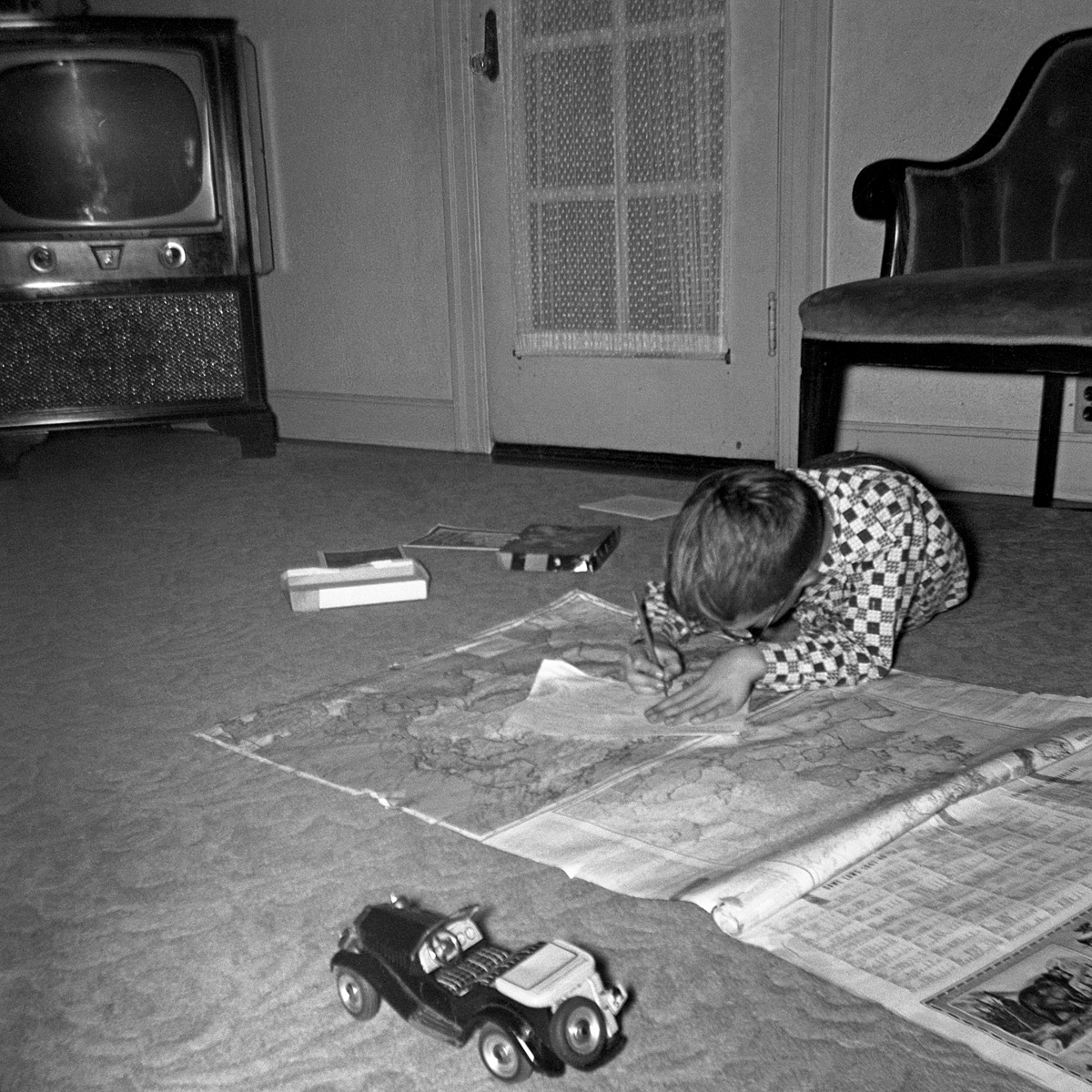It's November in 1954 and you're an 8 year-old boy; given the following options, what do you do?

a) Watch TV;
b) Play with cool toy MG sports car;
c) Unroll giant set of maps and trace the borders of Czechoslovakia.

Made sense to me then. Actually, I still understand it. View full size.