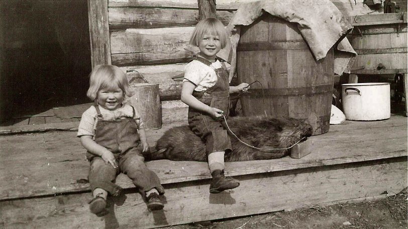 This was taken in Eastern Montana around 1927-29.  Mary, my grandmother riding the beaver, was born in 1924.  Not absolutely sure of her age in the photo.  Aunt Del is hanging out hamming it for the photo.
