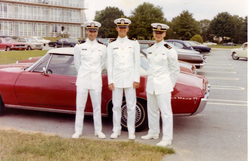 Four roommates at the NAS Whiting BOQ parking lot. The year 1969. We are just back from some event that required our dress white uniforms, less swords. It might have been a change of command ceremony, I can't remember. We are standing in front of Bill McClelland's snazzy red convertible. He is the photographer. Left to right, Nick Witzell, Terry Waldbeesser and Joe Schrock. We all started our training in  AOC Class 28-1968 in Pensacola Fl. Here we are still together during basic training. All of us got our wings. I stayed in contact with Bill into the 90s but lost contact with Terry and Joe during advanced training. If any Shorpy fan knows anymore about them, I would love to hear it. View full size.
