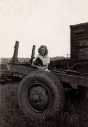 Ronceverte, West Virginia. Mid 1930s. View full size.
Sums it up pretty wellLogs, coal cars, road trailers related to logging and a confident, independent female of West Virginia origin. That's West Virginia in a photograph.
The Chesapeake and Ohio stock car adds ambience.
(ShorpyBlog, Member Gallery)