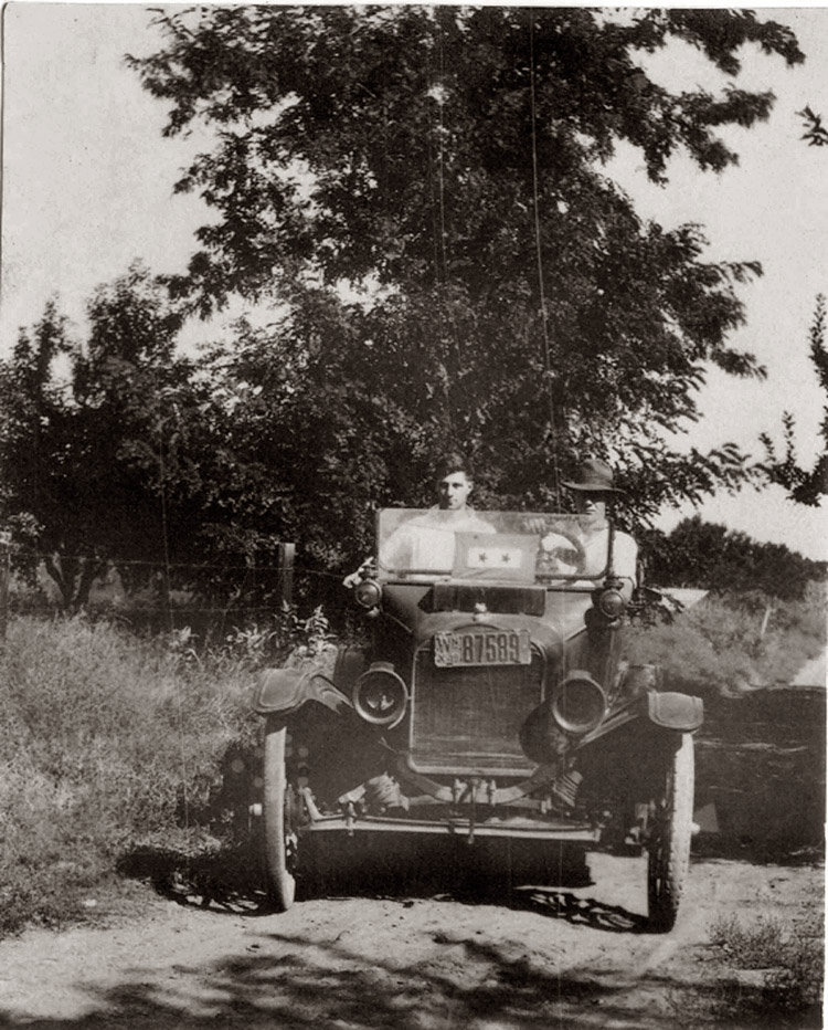 This came from grandparents. Most likely in Yakima Valley, Washington. Maybe my gramps and brother. License plate says 1919. Photographer unknown. The car is a Ford T.