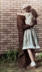 This is an image of my mother and her first husband when she was only 16 years old. He was home on leave from the Navy and this photo was taken in Joiner, Arkansas around 1946. View full size.
Not quite Times Square...but close enough.
(ShorpyBlog, Member Gallery)
