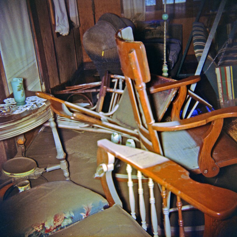 The living room of our summer house in East Guernewood, California, after the flood of December, 1955. Back then, this stuff was all considered junky enough for a summer cabin, but they'd be antiques today, particularly the Morris chair in the foreground. The porch swing had been brought inside for winter storage. This was definitely one of those world-of-reality crashes into world-of-childhood events for the 9 year-old me. I shot this on 2-1/4 square Kodacolor.
There's an exterior shot of the flood aftermath in the comments here.
